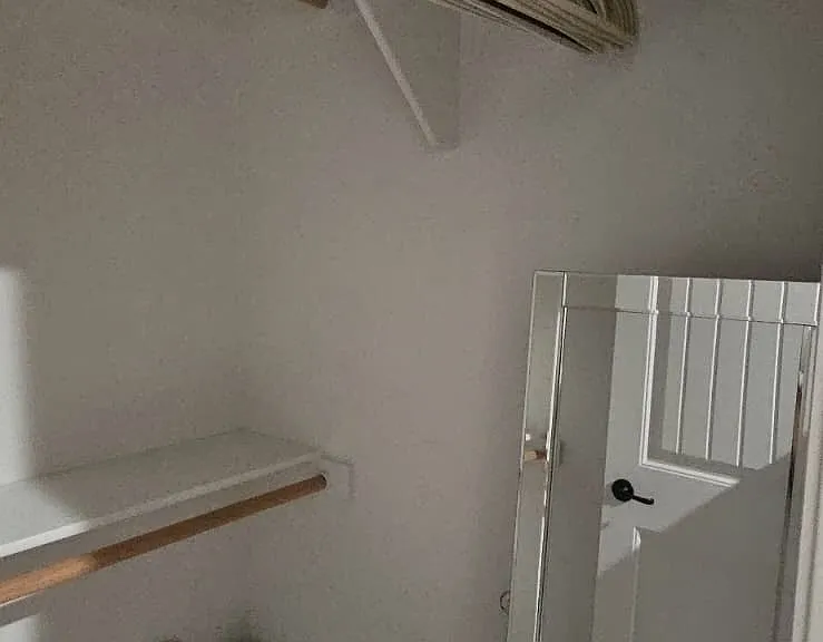 Bedroom 2 walk-in closet with jewellery cabinet.