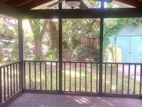 The screened in porch right of the kitchen and tv room. Green shed in backyard.