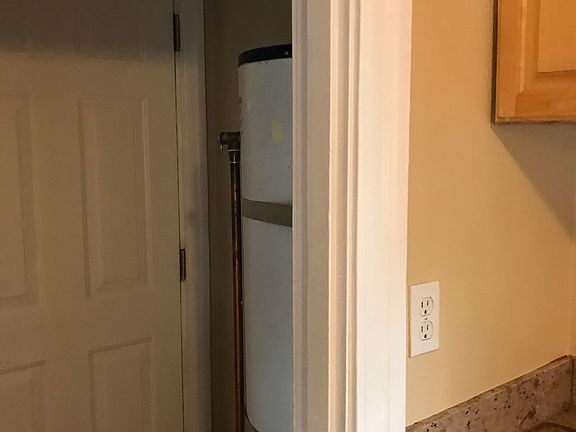 water heater / washer and dryer, door to backyard