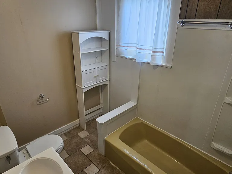 The smaller, second bathroom has a combination tub\shower.