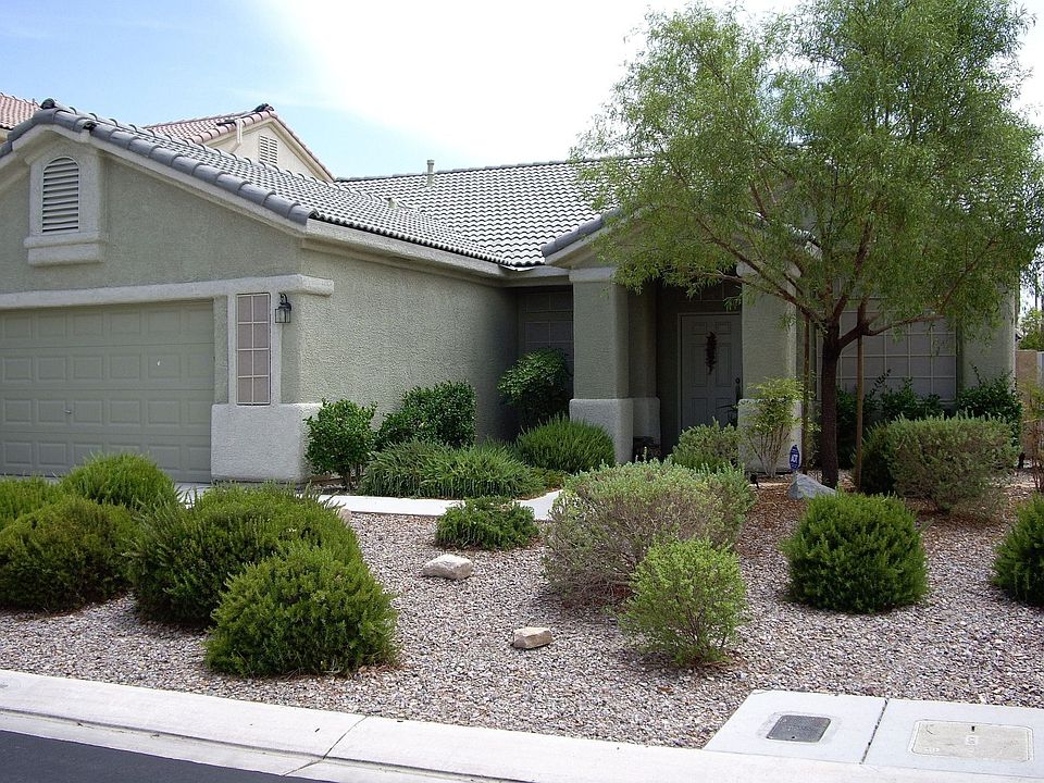 Solar screens, rock landscaping, 2 car garage,pool, 4 beds, 2 full baths