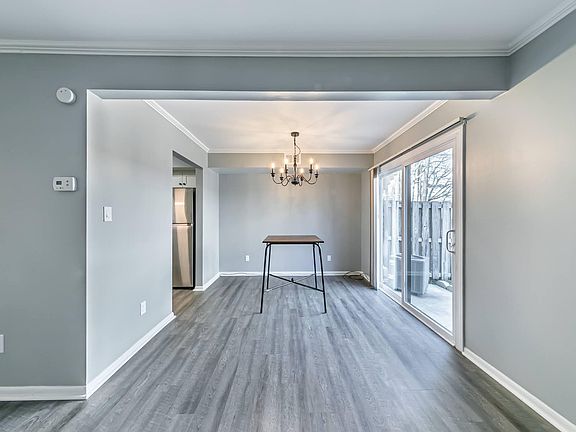 Open living/dining room with sliding glass door to private patio.