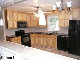 Kitchen with New Tile Floor, New Cabinets, New Countertops, New Backsplash and