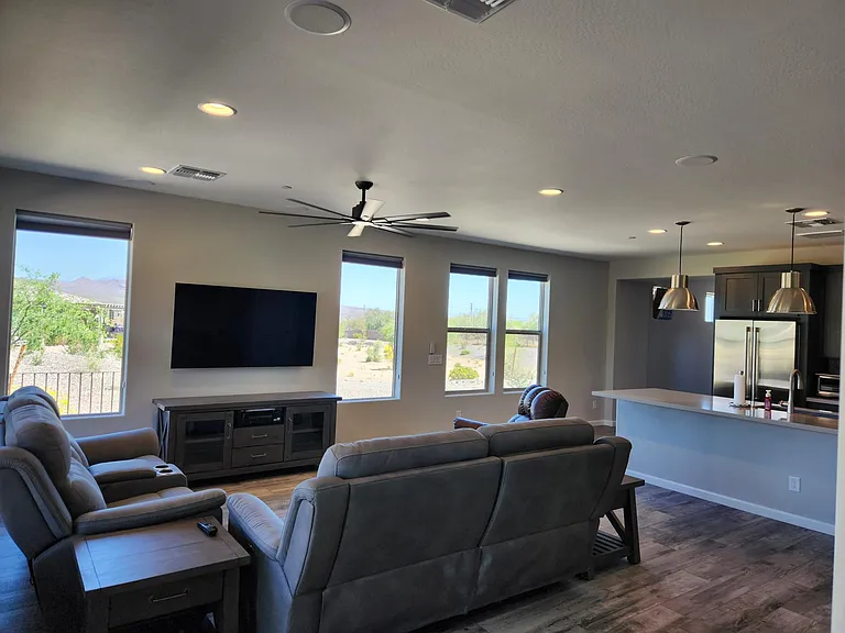 Living room with reclining couches and surround sound system