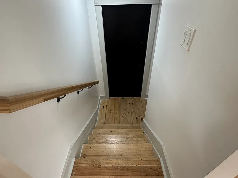 Staircase to side entrance & finished basement / lower level!