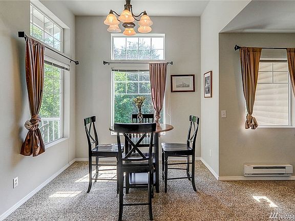 Dining area surrounded by windows. 