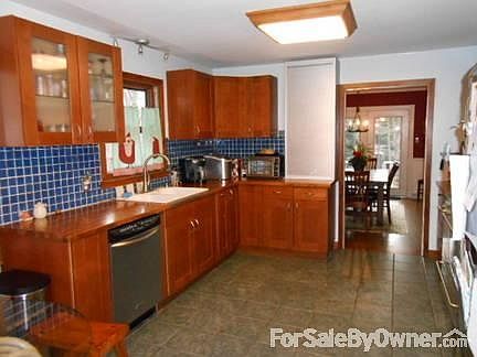 Spacious Country Kitchen
						:
						Abundant Natural Light, Tile Floor, Tile Backsplash, Double Sink, Walk-in Pantry
