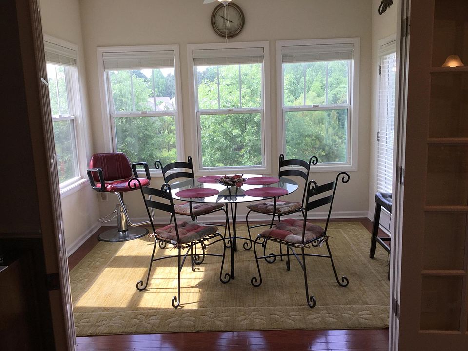 Sunroom overlooking lake and patio 