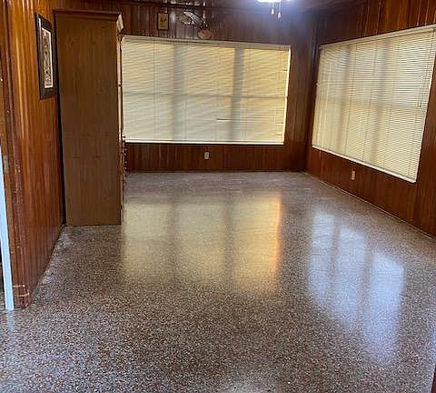 This stunning cedar-plank Florida room is bathed in natural light, offering a warm and inviting space to relax, entertain, or enjoy the beauty of the outdoors from the comfort of home.