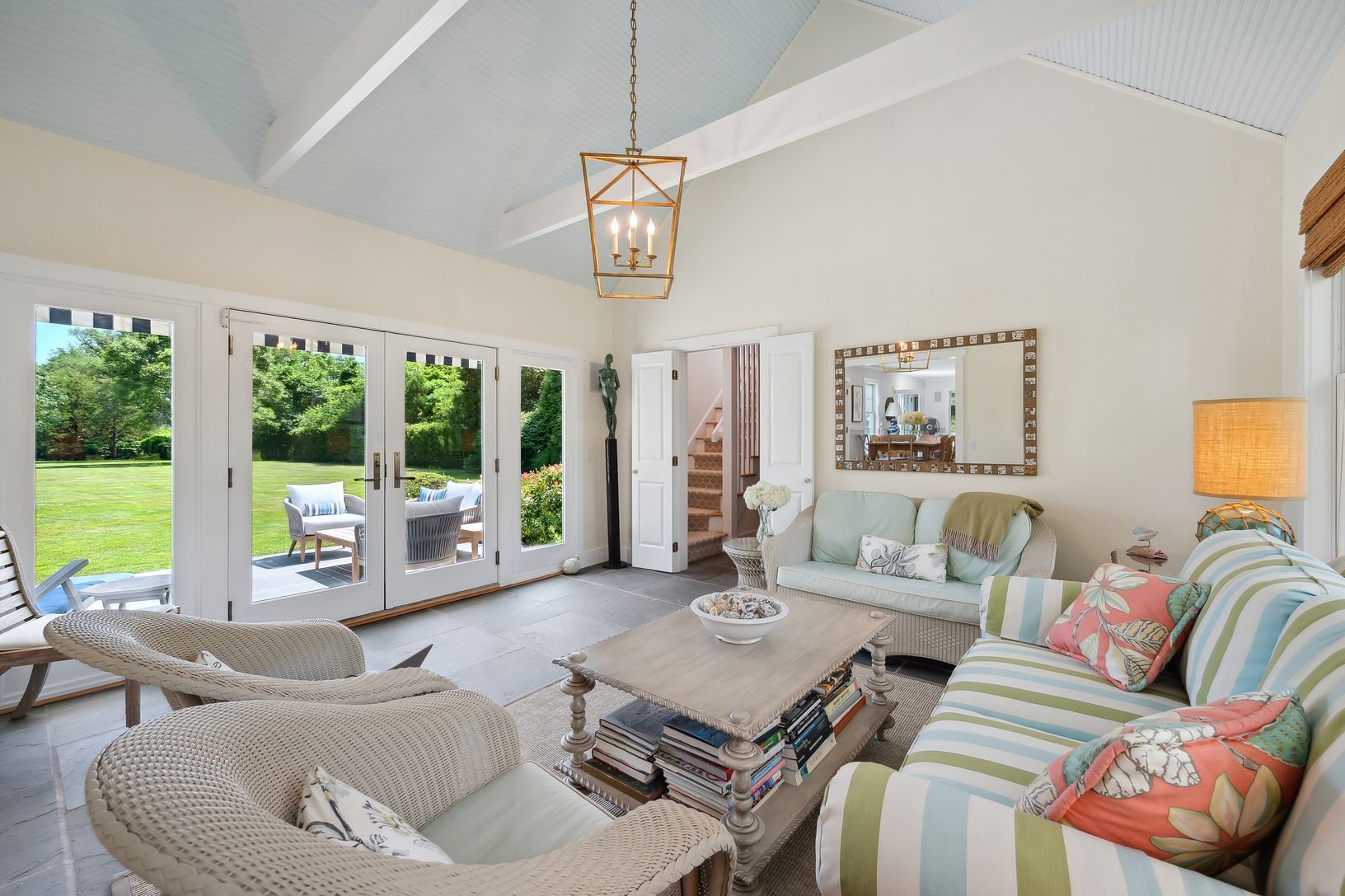 Beyond Sunroom, guests take stairs to private suite w/ king bed, Bath, Sitting Room and Balcony