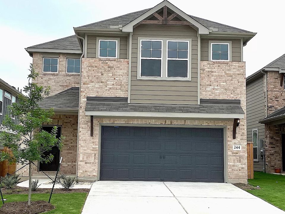 Front of the house with private driveway and 2 car garage