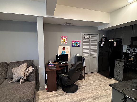 Living room & kitchen area with a desk