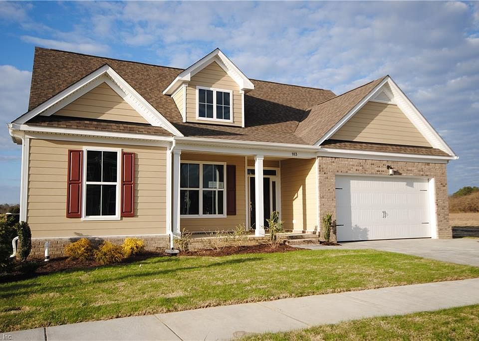 Waverly Floor Plan with traditional elevation, brick garage front, welcoming front porch.