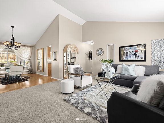 Living room adjacent to spacious formal dining room.
