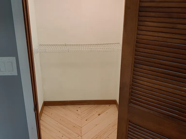 2 of 2 walk in closets for master bedroom.
