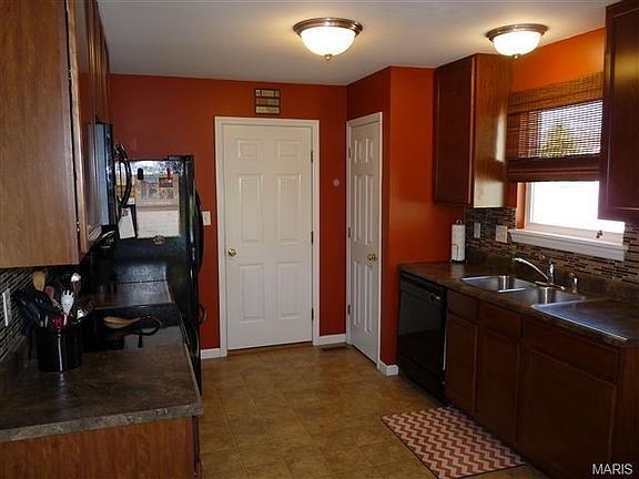 Kitchen with 42" cabinetry and pantry.