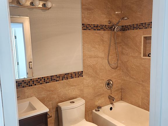 Full size bathroom with Tub and shower