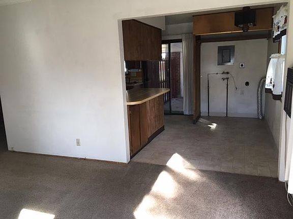 Living Room into Kitchen/Dining/Laundry closet