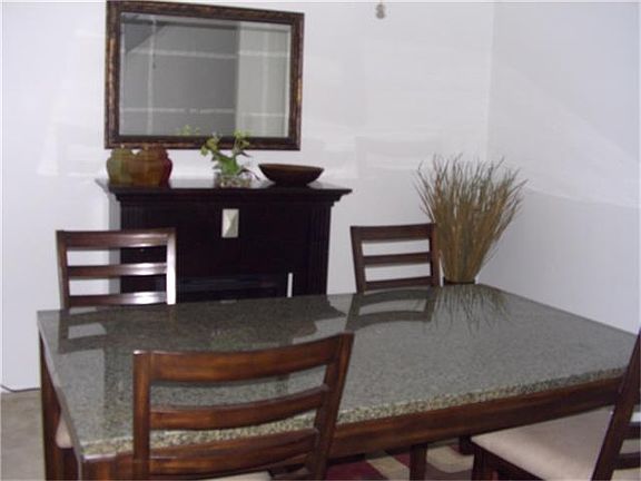 Formal dining off entry. Mock fireplace can be moved to another room if desired.