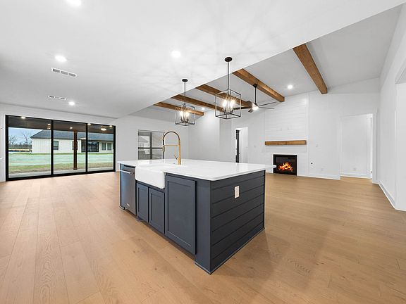 The open layout connects the kitchen with the breakfast area and family room.