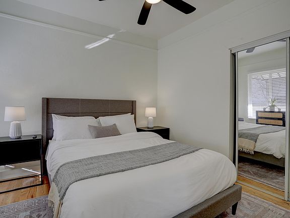 Front bedroom 1 with queen bed and smart tv