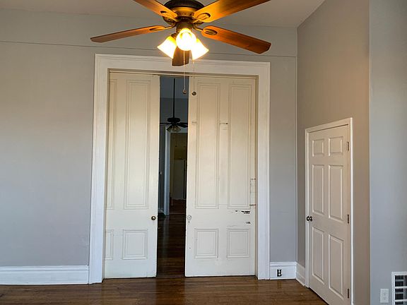 Second bedroom closet and pocket doors into the living room