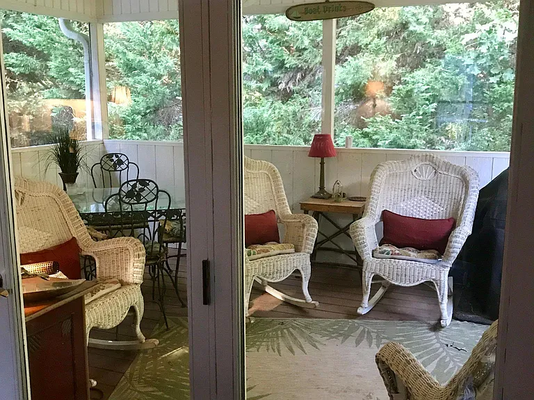 Dining area french doors open to screened porch