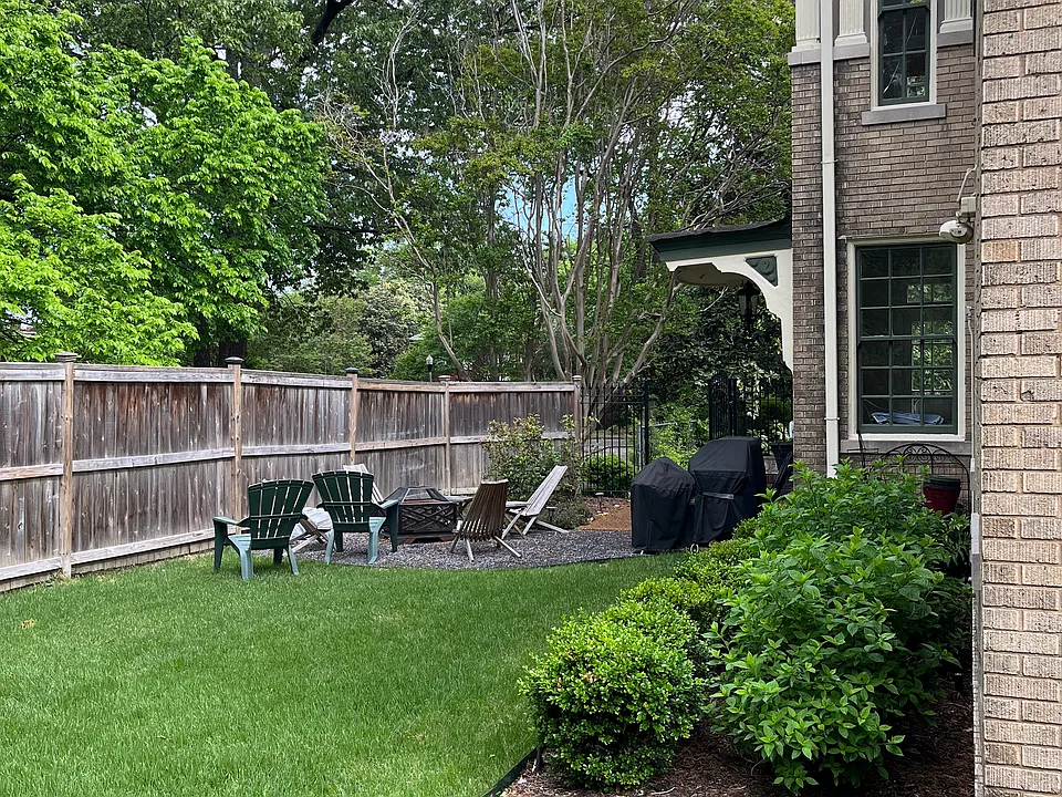 Side yard. Downstairs sunroom opens onto this yard