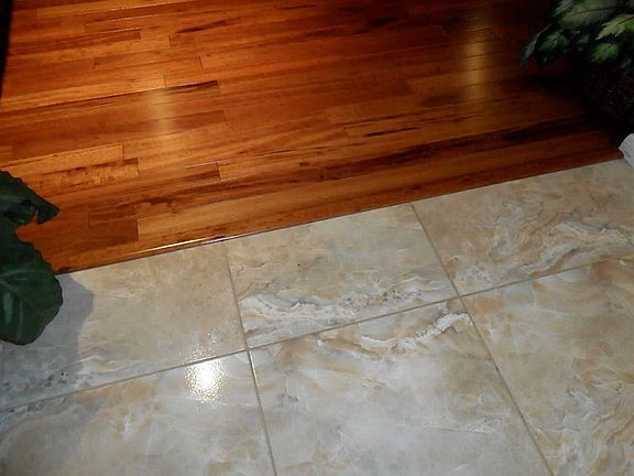 ceramic tile in kitchen and hardwoods in family room.