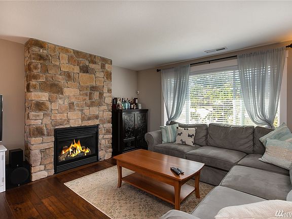 This home has been completely rebuilt. Newer electrical, plumbing, 94% gas furnace, windows, doors, gleaming wood floors, hardi siding and new roof in 2014/2015.  Stunning in every way. Living room features wood floors, fireplace and is so light and bright! 