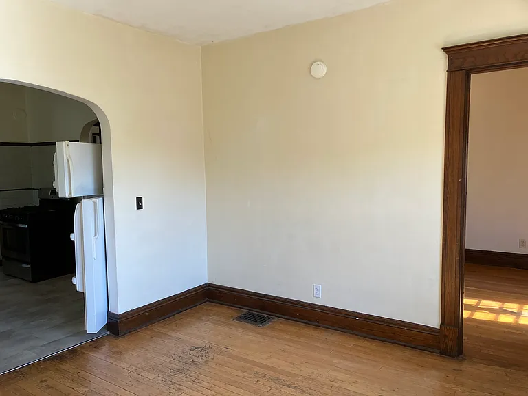living room, slight view into kitchen and front room off living room
