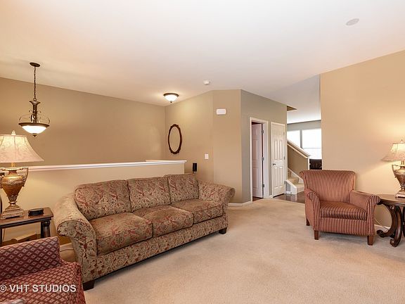 Spacious living room right off the kitchen for great overflow when entertaining.