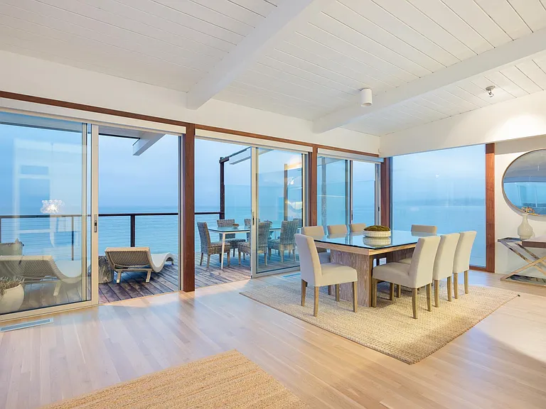 The lovely indoor-outdoor space is perfect for a dinner party.
