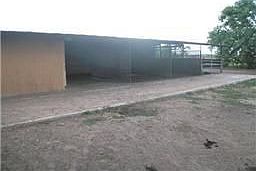 Look at this 7 stall horse barn with tack/feed room!! The hallway is concrete for easy cleaning.