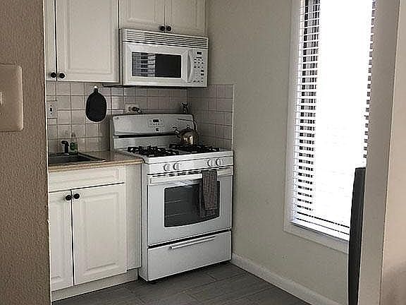 Kitchen, with full size appliances.