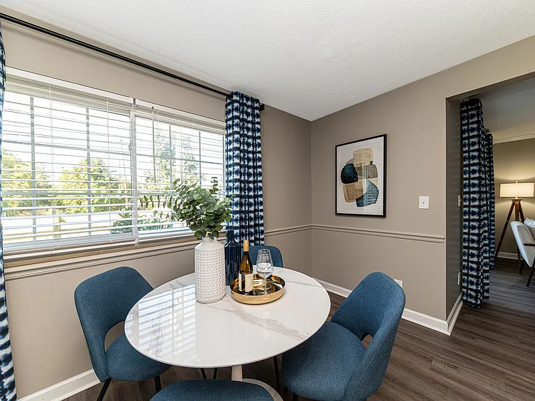 Dining area with hardwood-style flooring