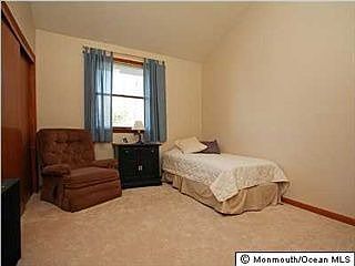 Bedroom with vaulted ceiling