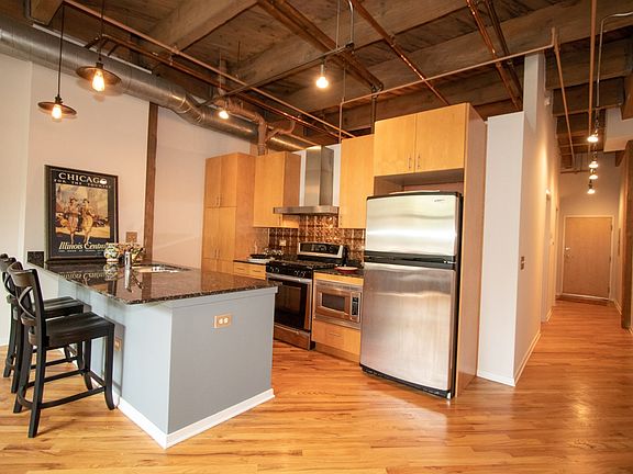Kitchen breakfast bar, stainless appliances and new tin backsplash