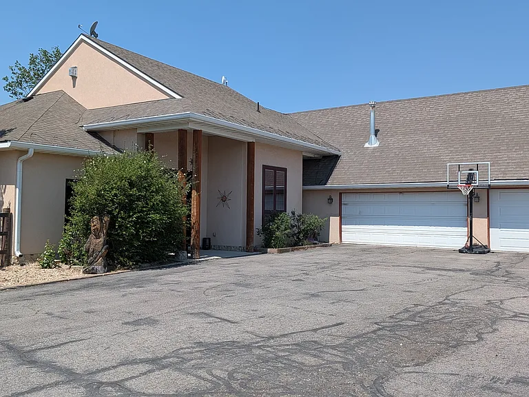 Picture of the house with 3 car garage