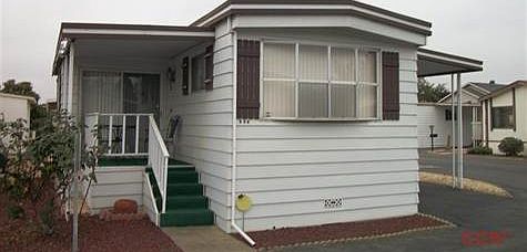 Front door and porch of corner lot house