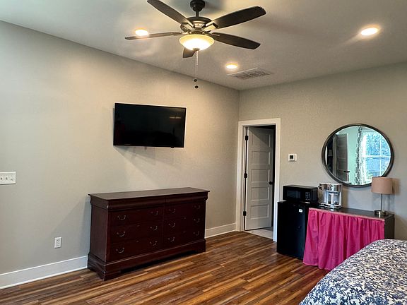 dresser, mini-refrigerator, microwave, and coffee pot