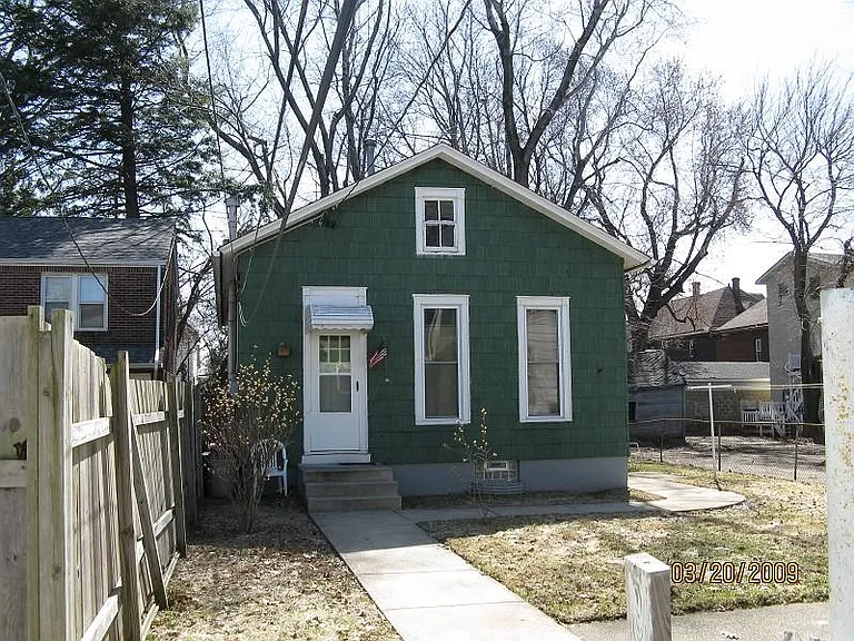 Small duplex located behind a large flat