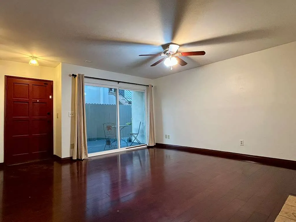 Living room, another angle view with Front door on left and sliding doors on right - 1328 9th St #6