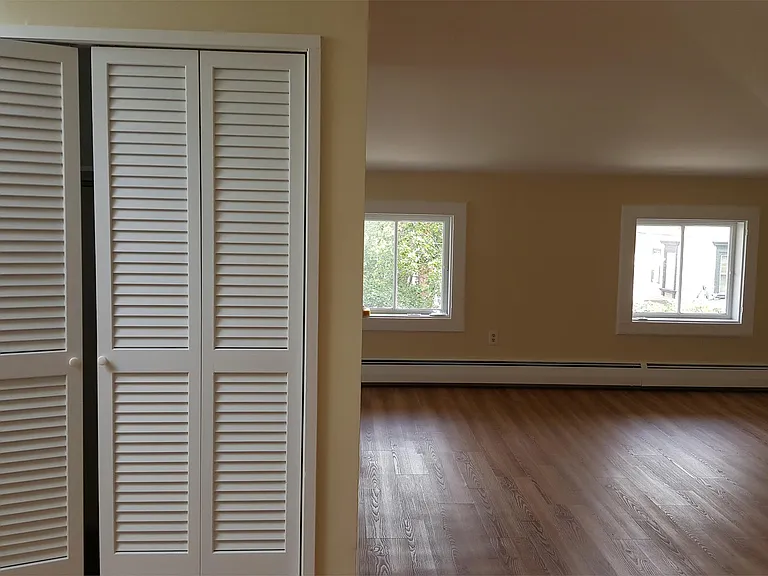 Closet at top of entry stairs. Dining Room\Living Room - windows face east. Lots of natural light.