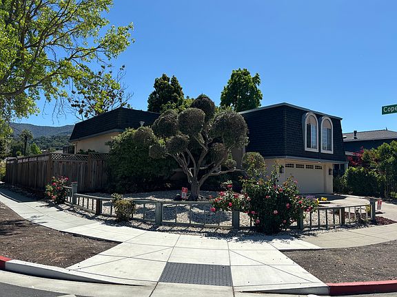 Looking at the home from across the street on Anne Way