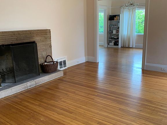 living room with fireplace, looking towards dining room