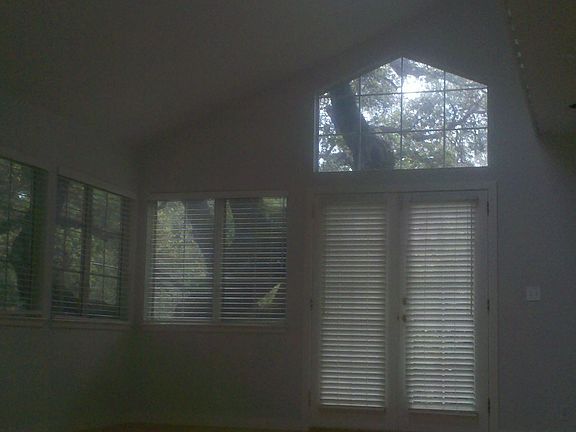 Family room, left as you enter home, bay view and surrounded by old oaks.  