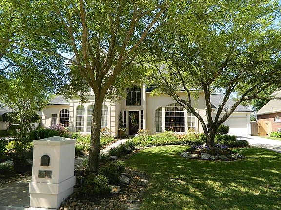 A slightly different perspective reveals the detached garage. It is an oversized garage with a large