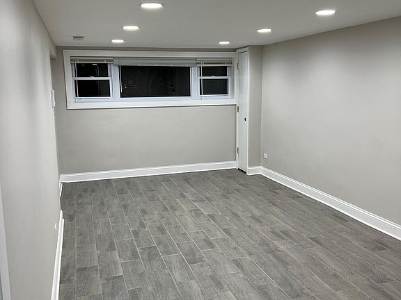 Living Room / Dining Room - Large windows let in good natural light