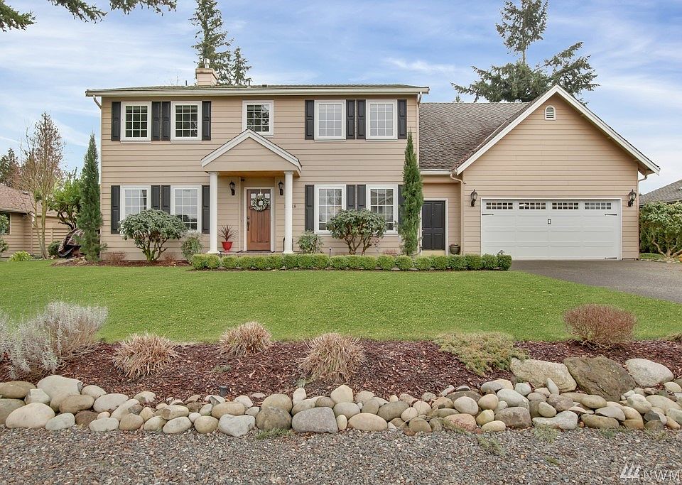 Welcome home to this recently remodeled Tapps Island golf course retreat*Located on the 5th green, enjoy open views including peek a boo of Mt Rainier*Charm and character and meticulously maintained*Oversized 2 car garage